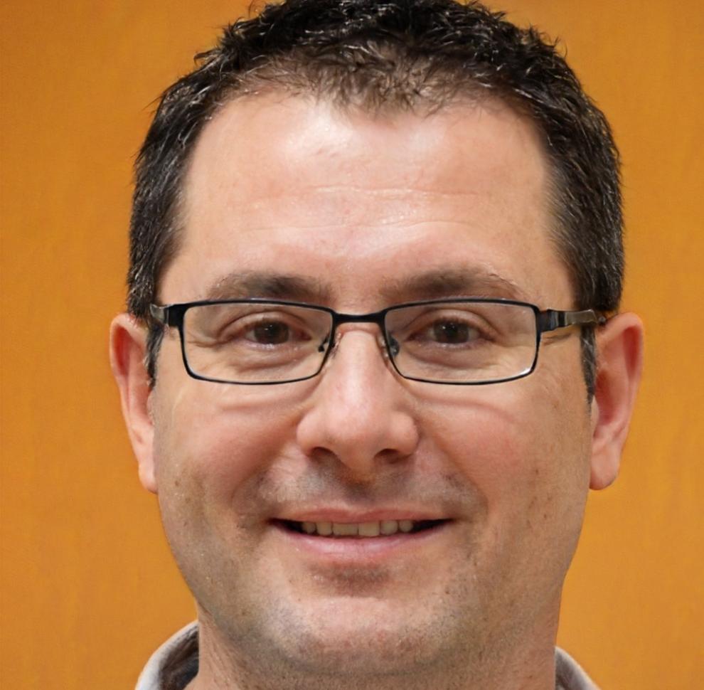 Professional headshot of senior financial analyst